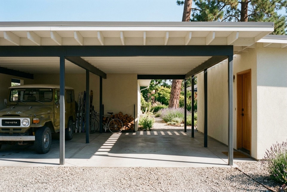 Carport, not garage. Leaving the walls off is lighter, cheaper and better, and you see straight through the house.