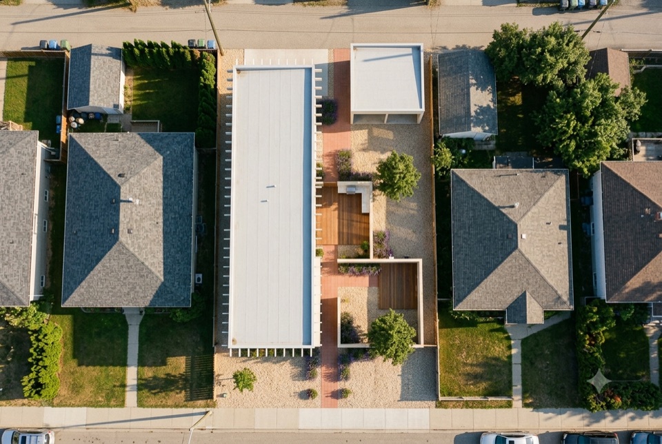 A 33 foot skinny lot. No back yard, just a chain of small courts down one side. Ours is the pale roof.